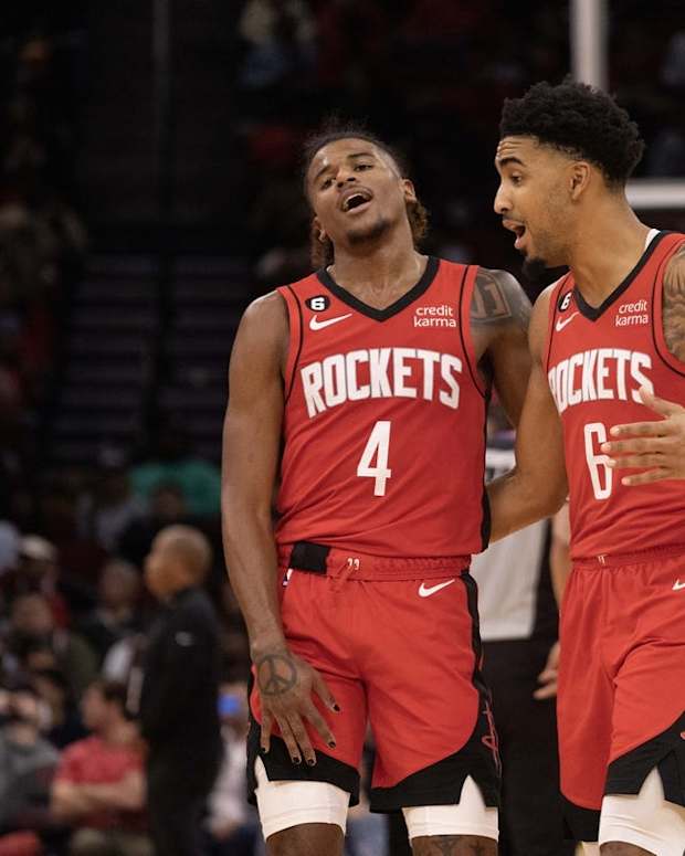 Nov 14, 2022; Houston, Texas, USA; Houston Rockets guard Jalen Green (4) and forward Kenyon Martin Jr. (6) communicate during a LA Clippers timeout in the third quarter at Toyota Center. Mandatory Credit: Thomas Shea-USA TODAY Sports